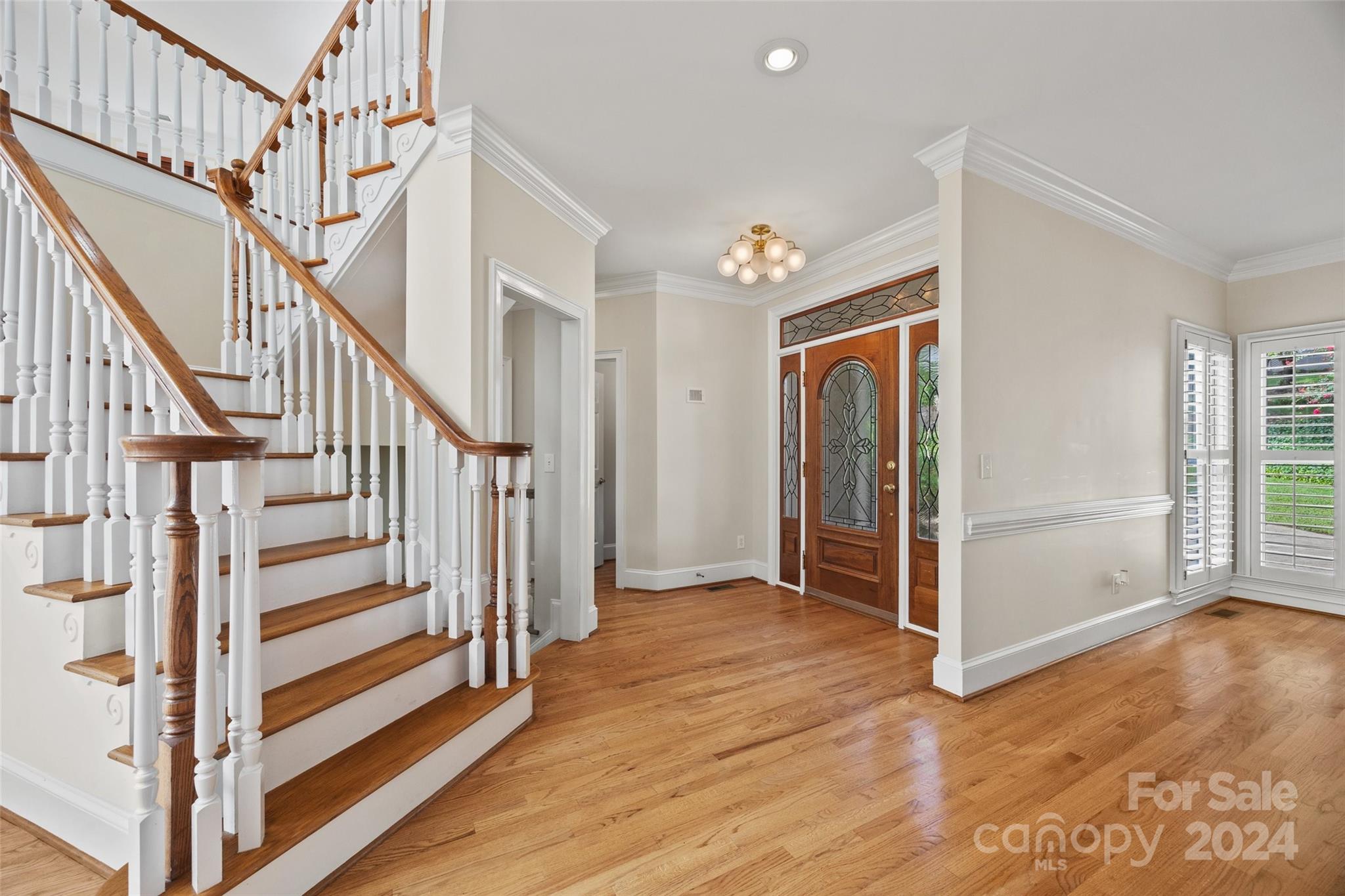 16201 Crest Cove Road Charlotte, NC 28278 - Photo 3 of 48 a view of entryway with wooden floor and stairs