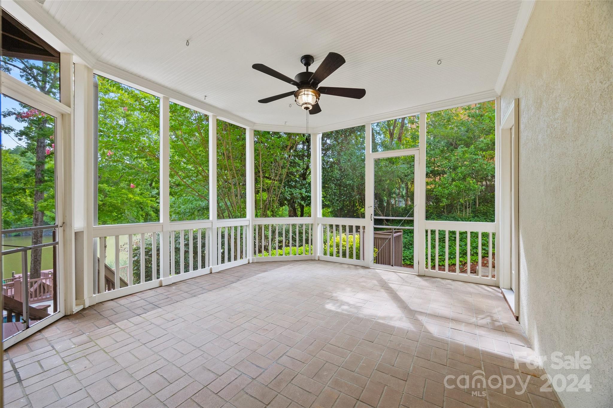 16201 Crest Cove Road Charlotte, NC 28278 - Photo 31 of 48 a view of a porch with a floor to ceiling window
