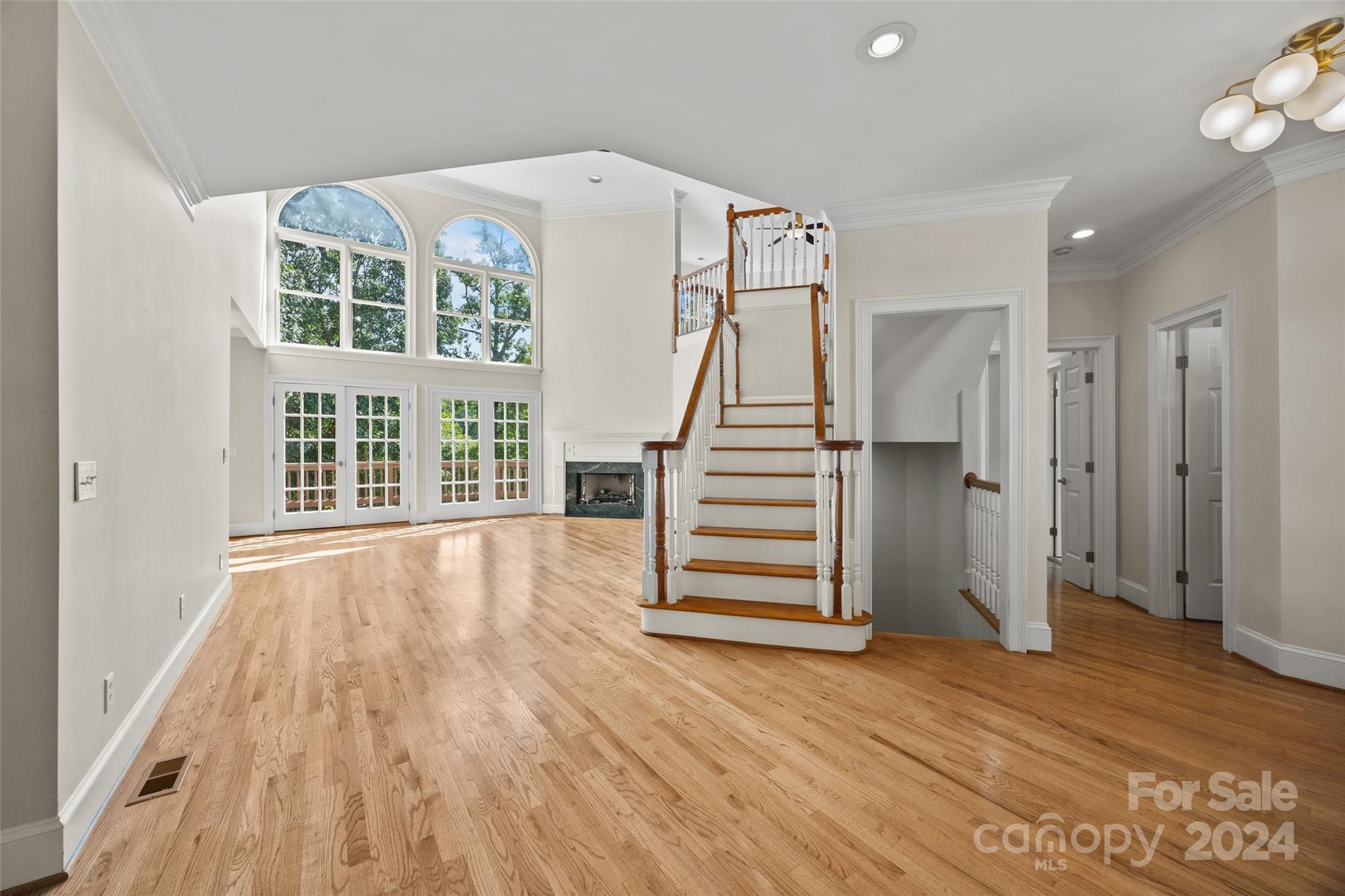 16201 Crest Cove Road Charlotte, NC 28278 - Photo 4 of 48 a view of entryway with wooden floor and stairs