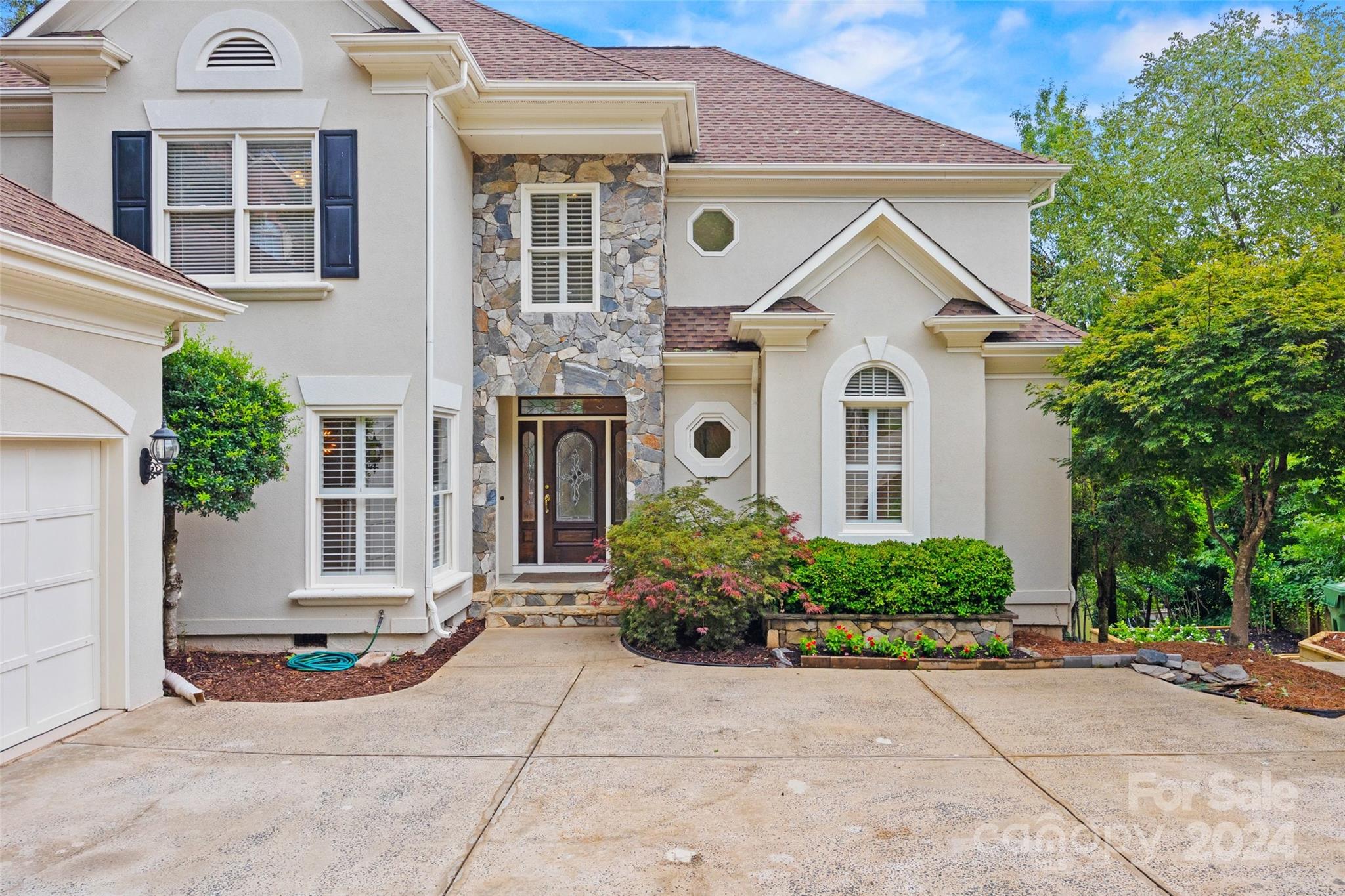 16201 Crest Cove Road Charlotte, NC 28278 - Photo 47 of 48 a view of a white house with large windows and plants
