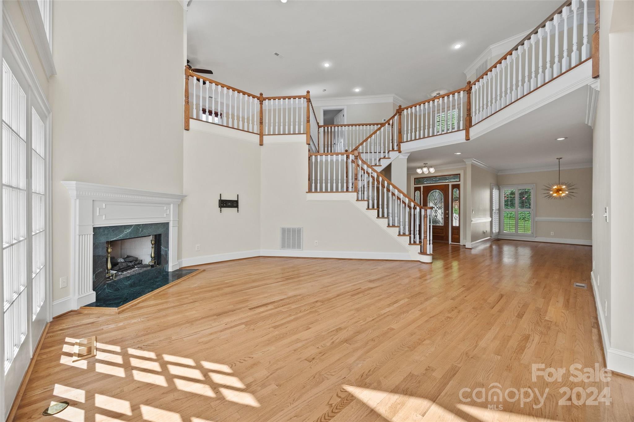 16201 Crest Cove Road Charlotte, NC 28278 - Photo 5 of 48 a view of empty room with wooden floor