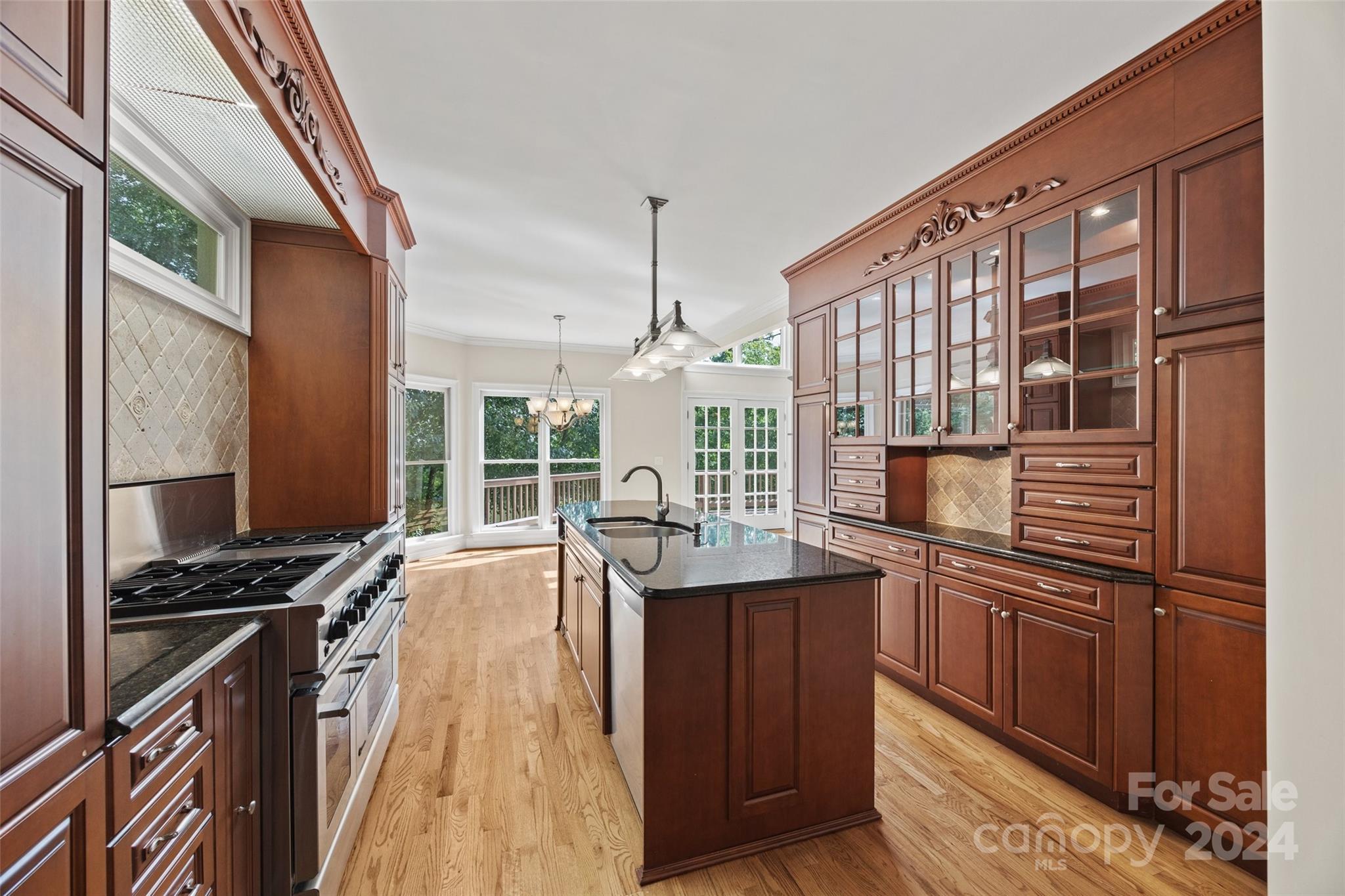16201 Crest Cove Road Charlotte, NC 28278 - Photo 7 of 48 a kitchen with stainless steel appliances a sink stove and refrigerator