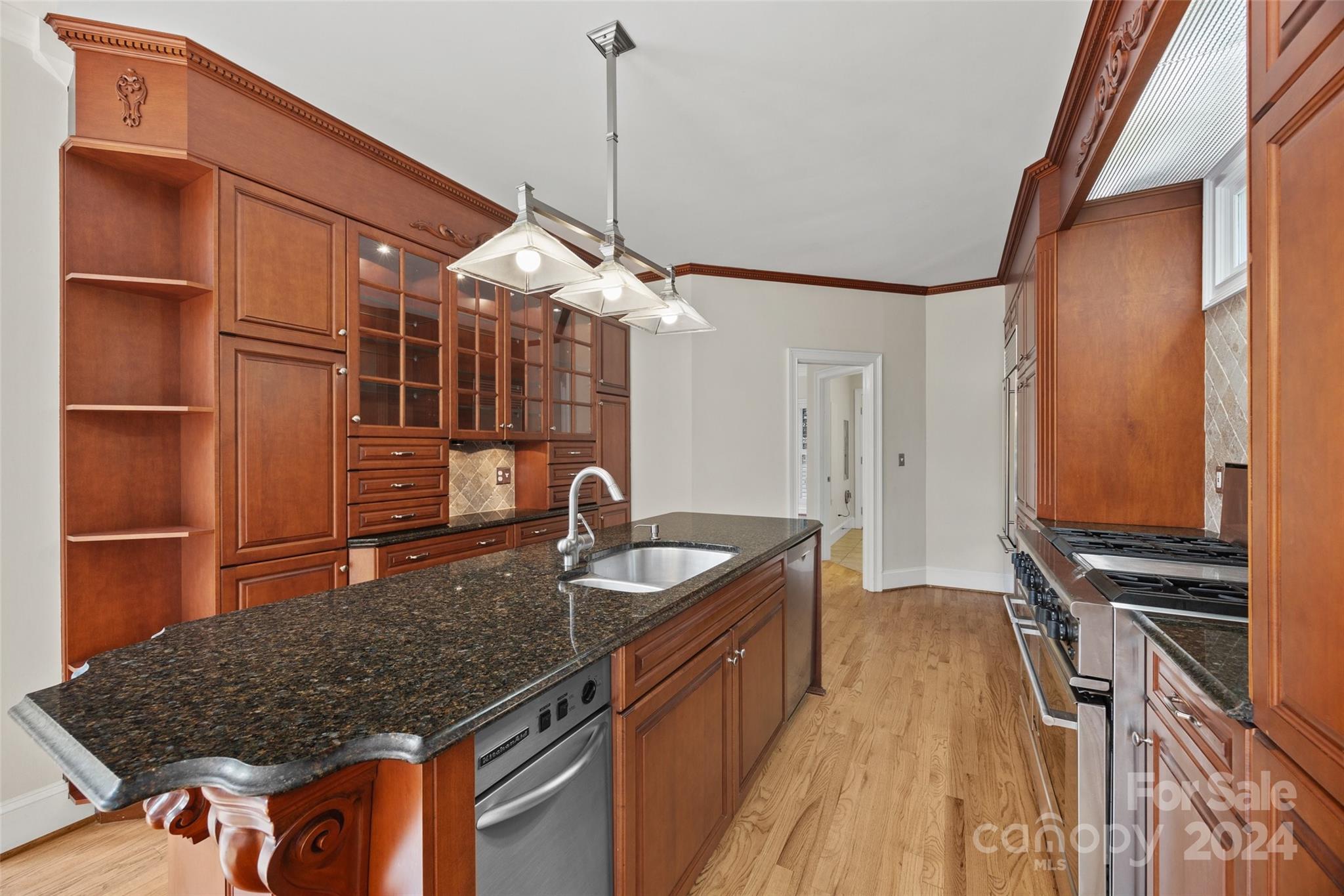 16201 Crest Cove Road Charlotte, NC 28278 - Photo 8 of 48 a kitchen with granite countertop a sink a counter space and stainless steel appliances