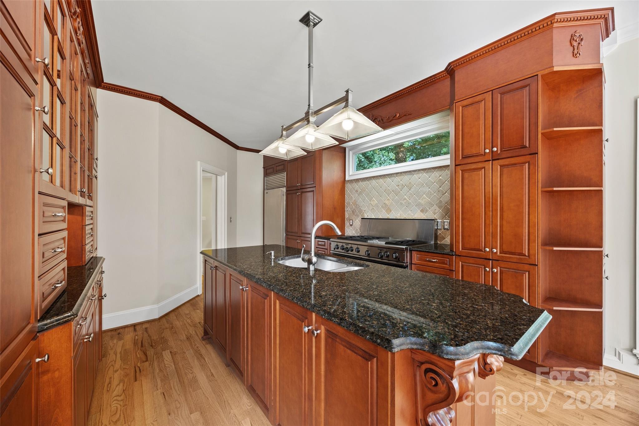 16201 Crest Cove Road Charlotte, NC 28278 - Photo 9 of 48 a kitchen with stainless steel appliances granite countertop a sink dishwasher and cabinets with wooden floor