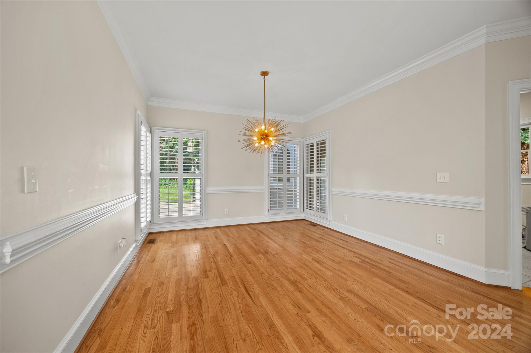 16201 Crest Cove Road Charlotte, NC 28278 - Photo 10 of 48 a view of empty room with wooden floor and fan