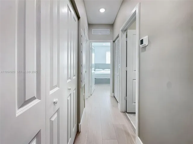 a view of a bathroom from the hallway