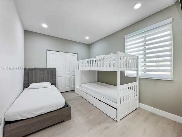 a living room with a balcony furniture and a window
