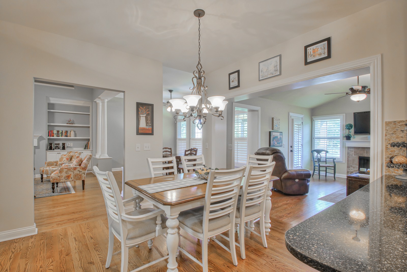 244 Chester Stevens Road Franklin, TN 37067 - Photo 14 of 56 a dining room with furniture a chandelier and wooden floor