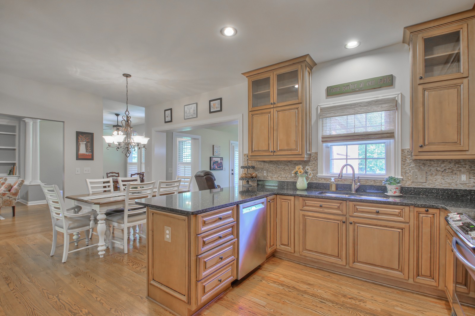 244 Chester Stevens Road Franklin, TN 37067 - Photo 15 of 56 a kitchen with kitchen island granite countertop a sink and cabinets