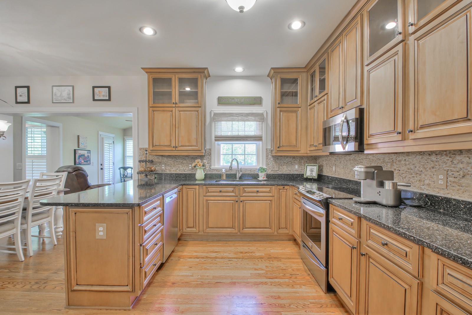 244 Chester Stevens Road Franklin, TN 37067 - Photo 17 of 56 a kitchen with stainless steel appliances granite countertop a sink stove and cabinets