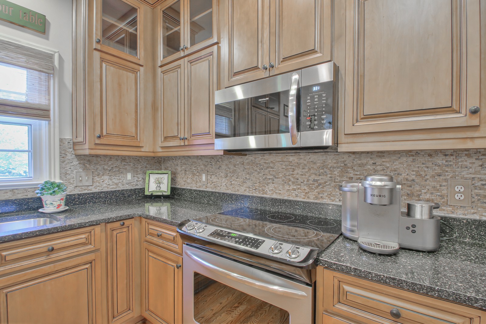 244 Chester Stevens Road Franklin, TN 37067 - Photo 18 of 56 a kitchen with granite countertop cabinets and window