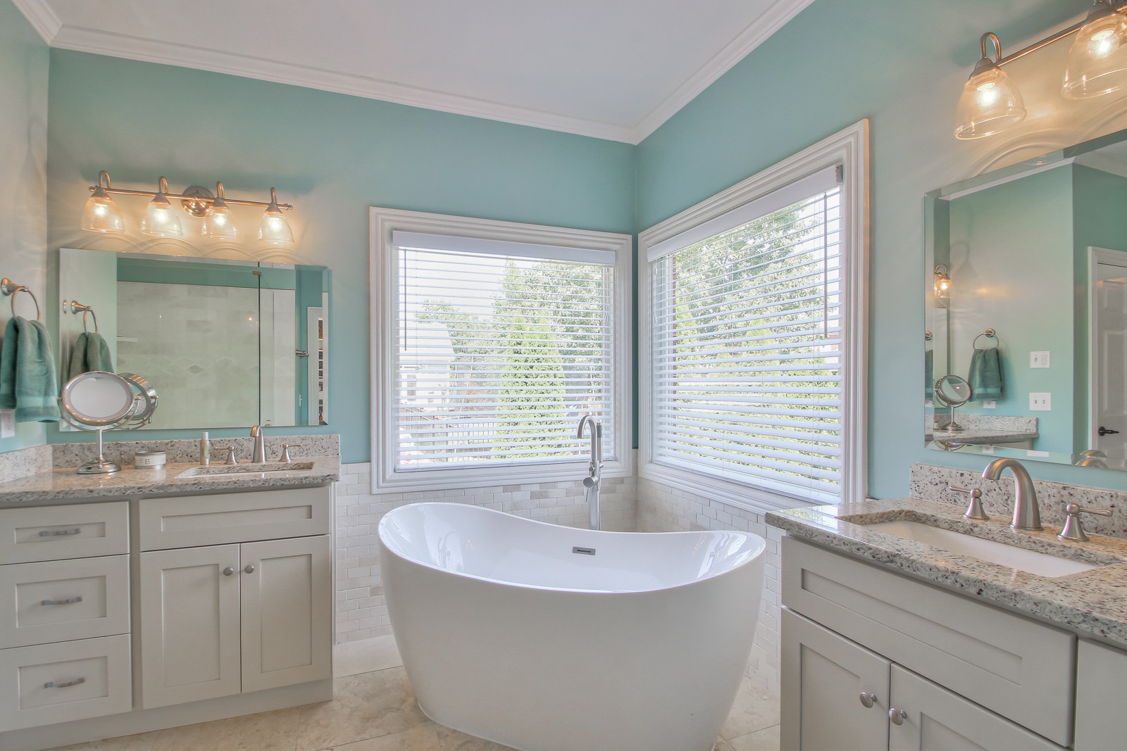 244 Chester Stevens Road Franklin, TN 37067 - Photo 22 of 56 a bathroom with a double vanity sink a mirror and a bathtub