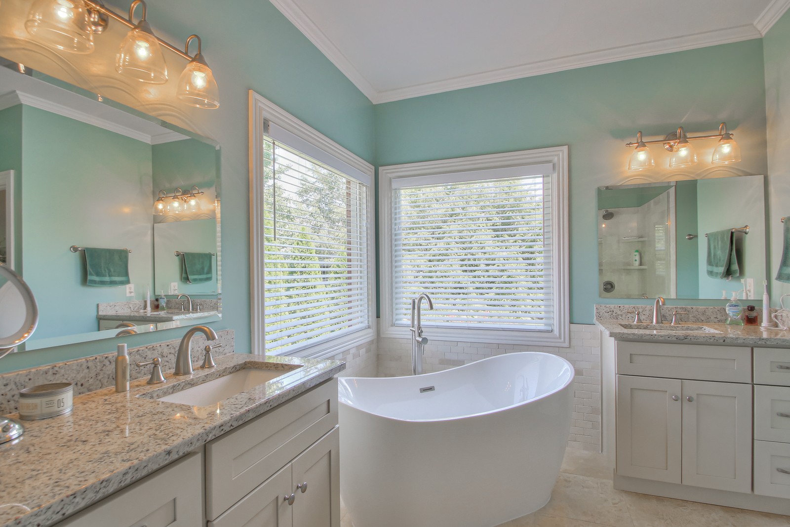244 Chester Stevens Road Franklin, TN 37067 - Photo 23 of 56 a bathroom with a granite countertop sink and a large mirror