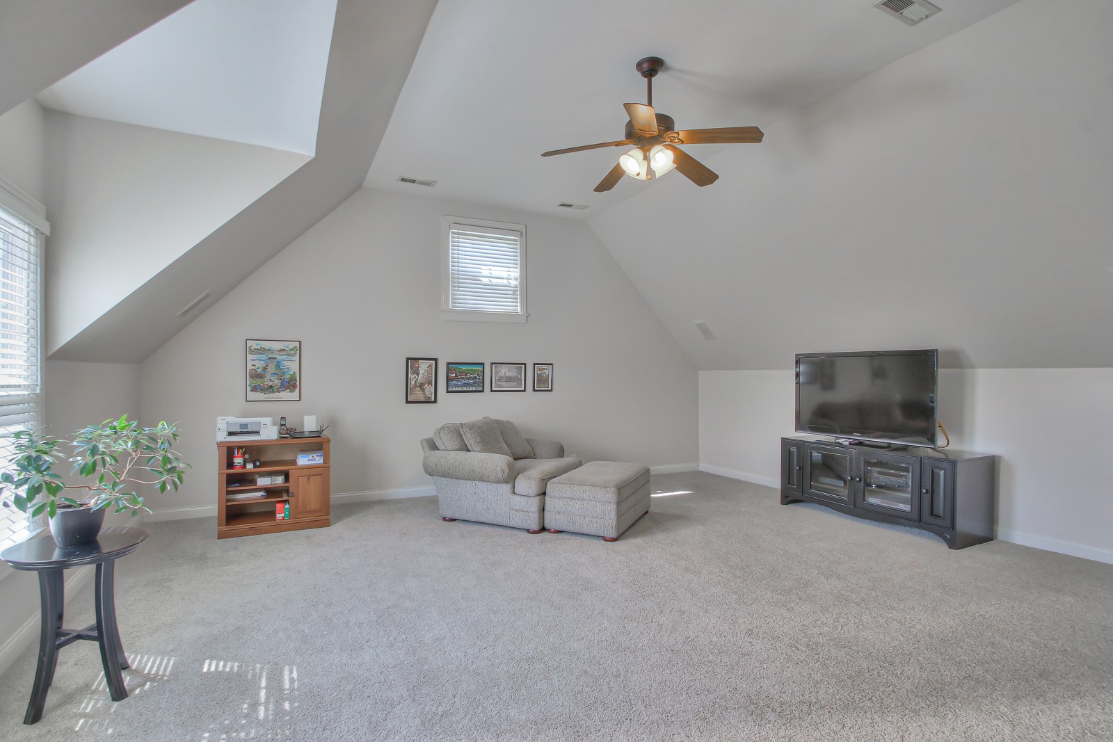 244 Chester Stevens Road Franklin, TN 37067 - Photo 36 of 56 a living room with furniture and a flat screen tv
