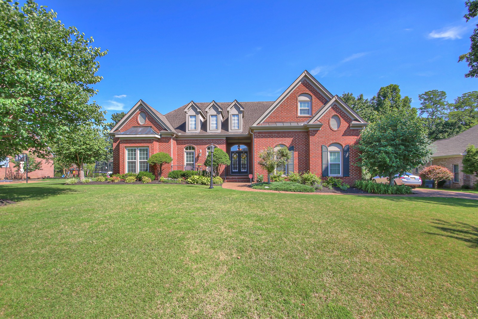 244 Chester Stevens Road Franklin, TN 37067 - Photo 52 of 56 a front view of a house with garden