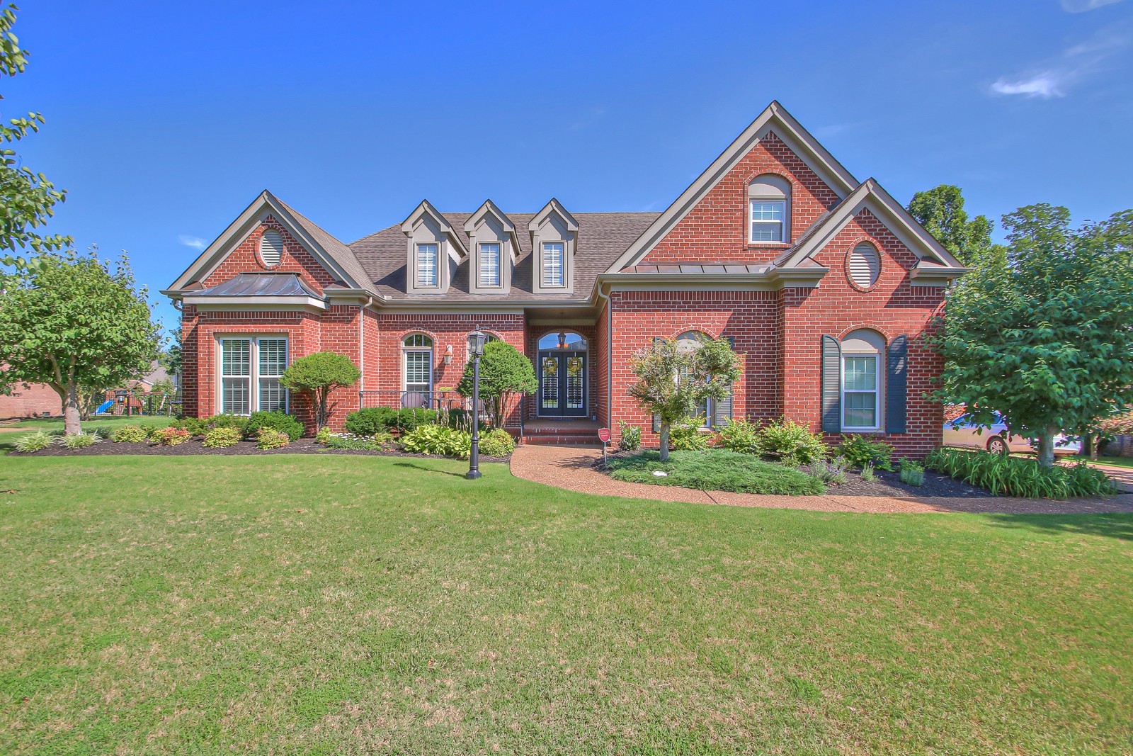 244 Chester Stevens Road Franklin, TN 37067 - Photo 53 of 56 a front view of a house with a yard and garage