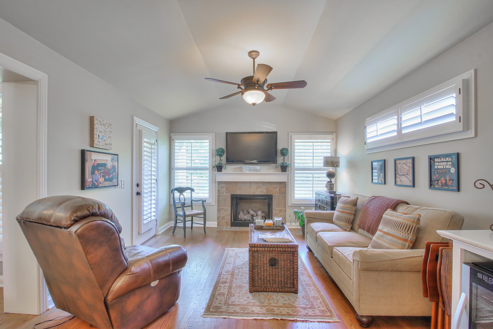 244 Chester Stevens Road Franklin, TN 37067 - Photo 9 of 56 a living room with furniture a fireplace and a flat screen tv