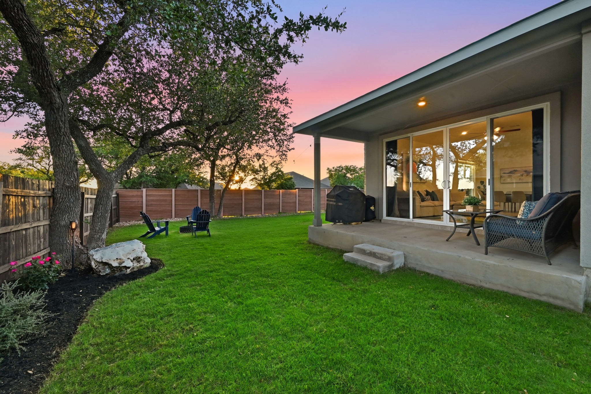 4420 Ingram Road Georgetown, TX 78628 - Photo 28 of 40 An inviting backyard oasis offers ample green space and a covered patio, perfect for evening gatherings.