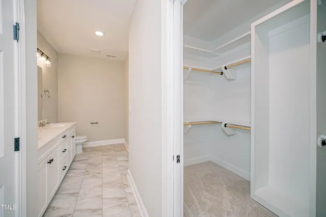a bathroom with a double vanity sink and mirror