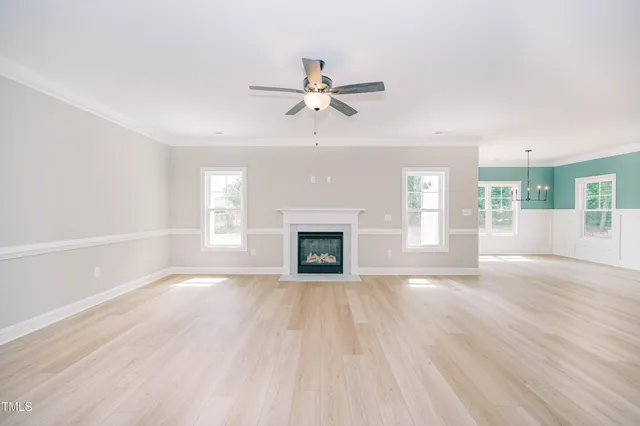 a kitchen with granite countertop a refrigerator and a sink