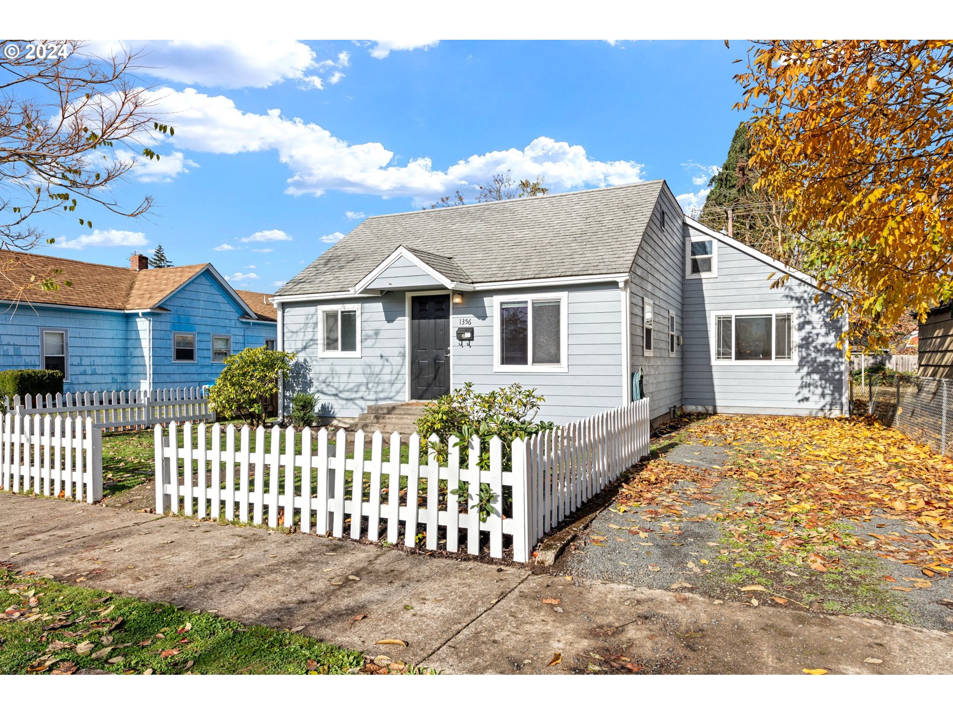 1356 D Street Springfield, OR 97477 - Photo 1 of 45 a front view of a house with a garden