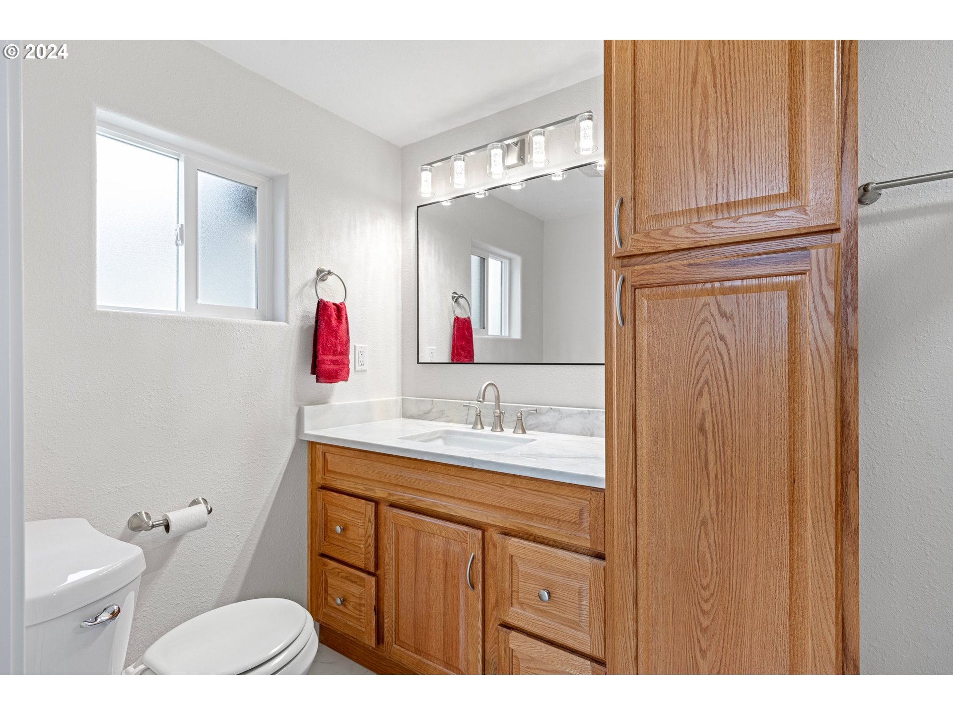 1356 D Street Springfield, OR 97477 - Photo 11 of 45 a bathroom with a granite countertop sink and a mirror
