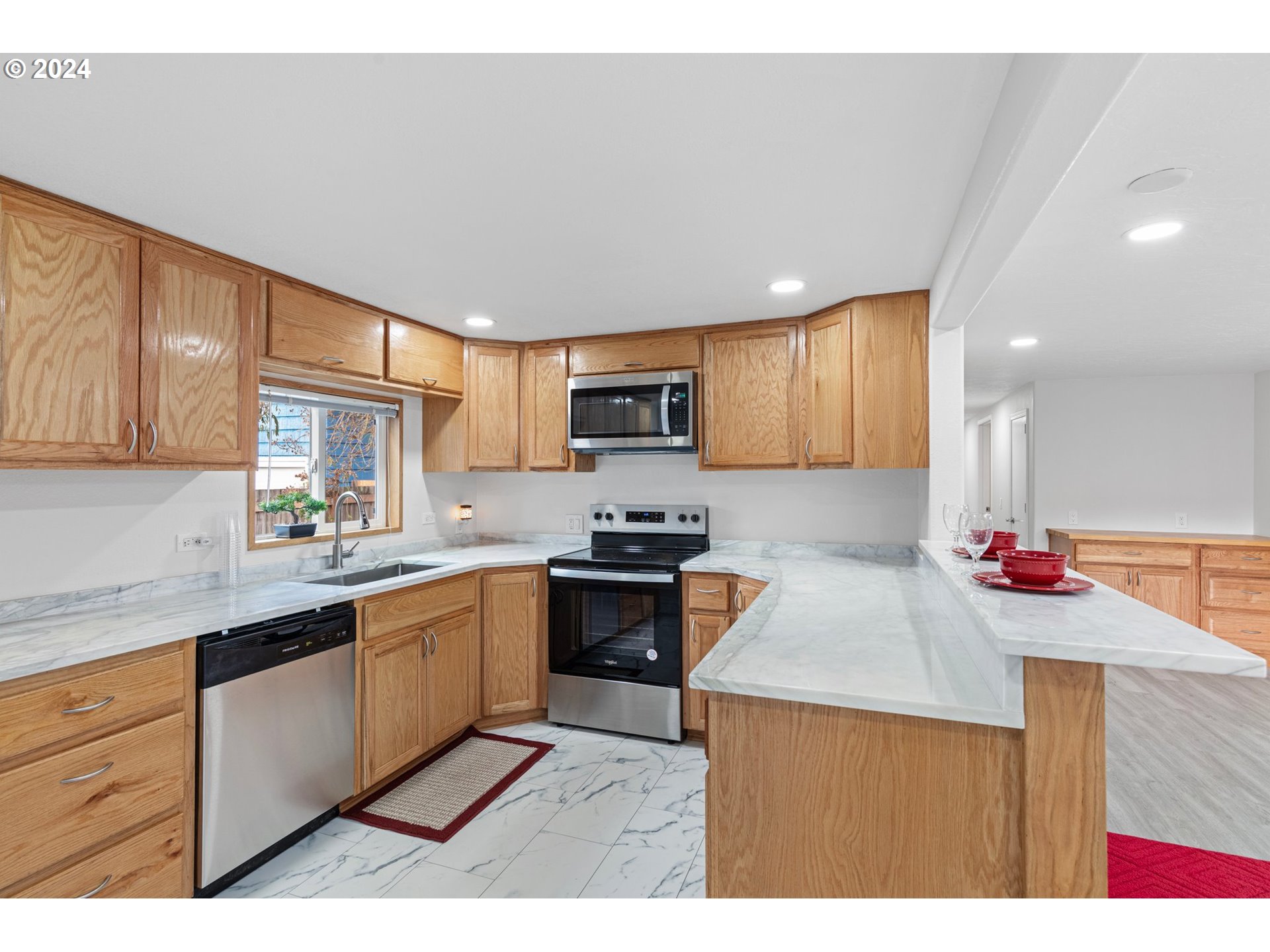 1356 D Street Springfield, OR 97477 - Photo 15 of 45 a kitchen with stainless steel appliances granite countertop a sink stove and refrigerator