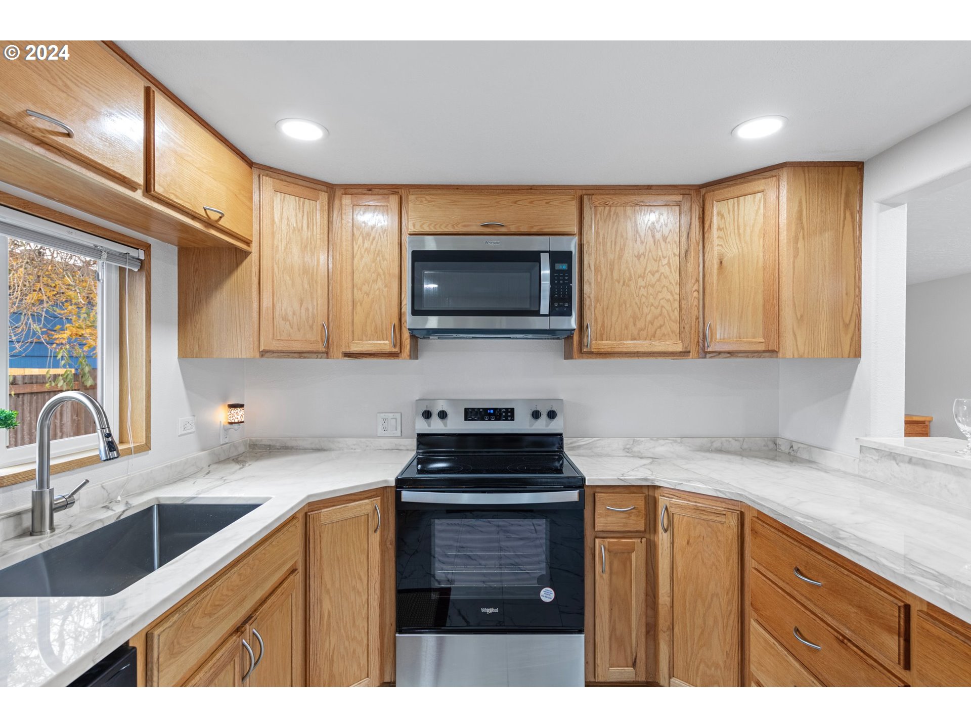 1356 D Street Springfield, OR 97477 - Photo 17 of 45 a kitchen with a sink a stove and cabinets