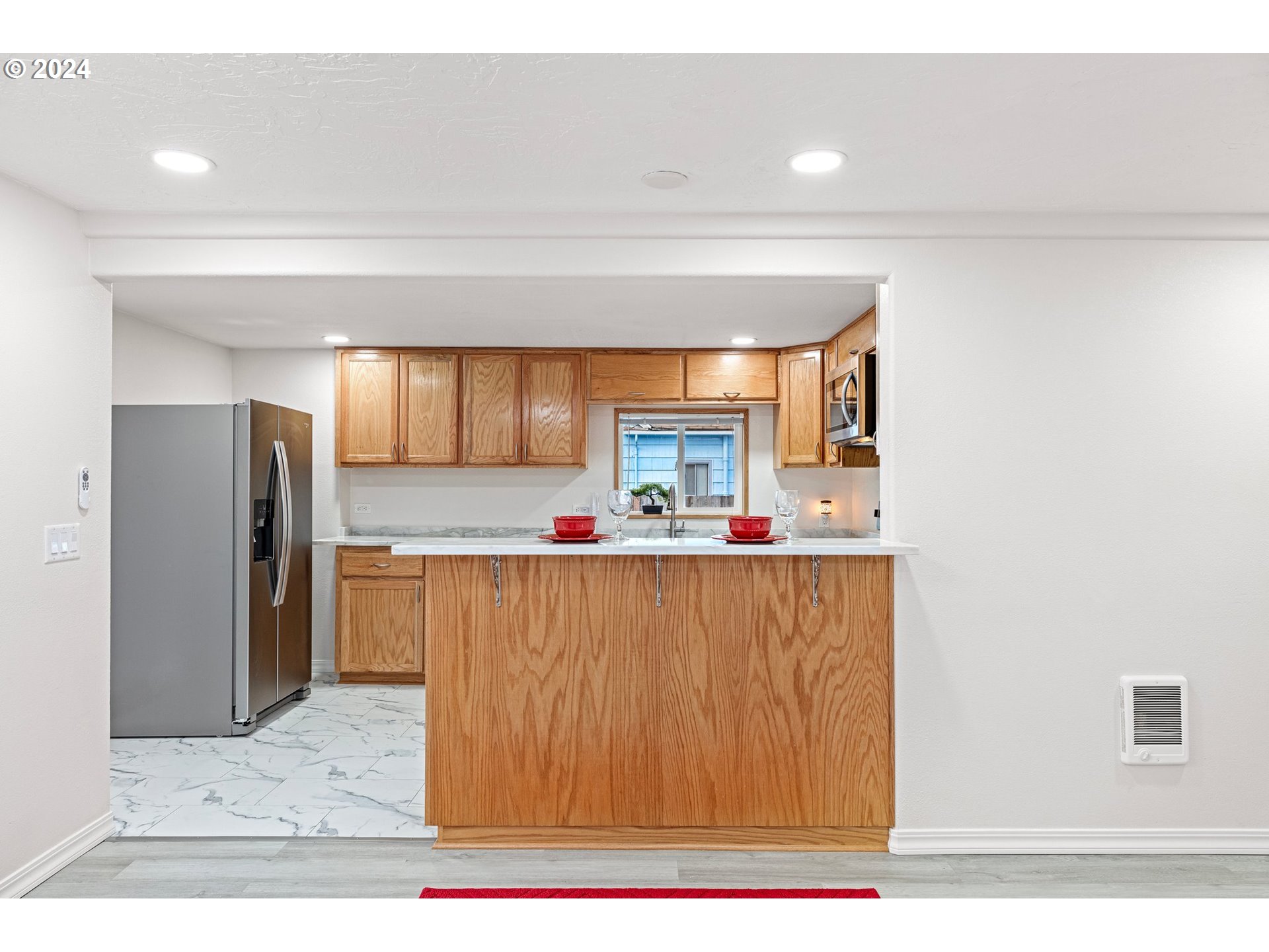 1356 D Street Springfield, OR 97477 - Photo 21 of 45 a living room with stainless steel appliances kitchen island granite countertop a refrigerator and a sink