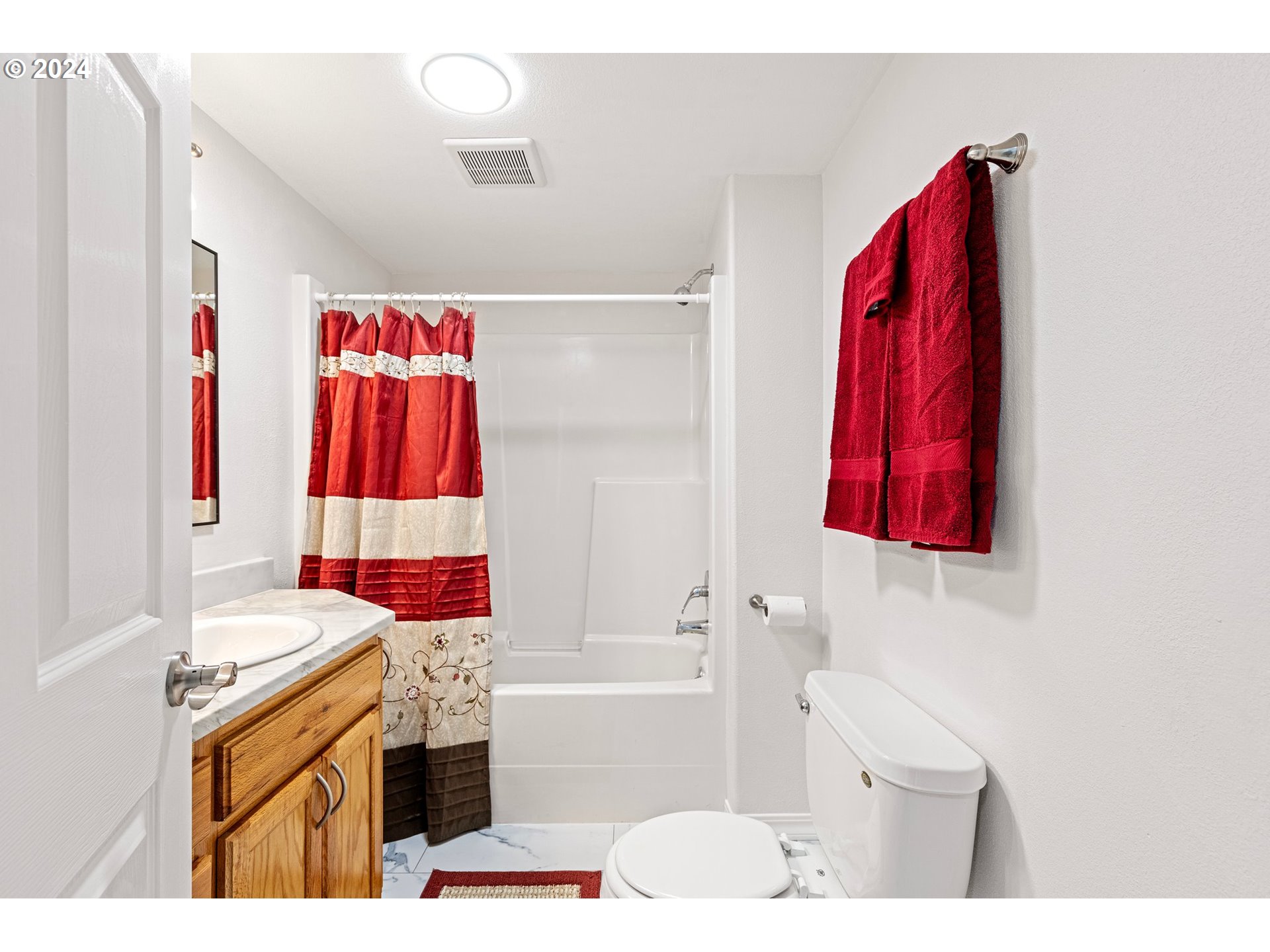 1356 D Street Springfield, OR 97477 - Photo 24 of 45 a bathroom with a sink vanity tub and shower
