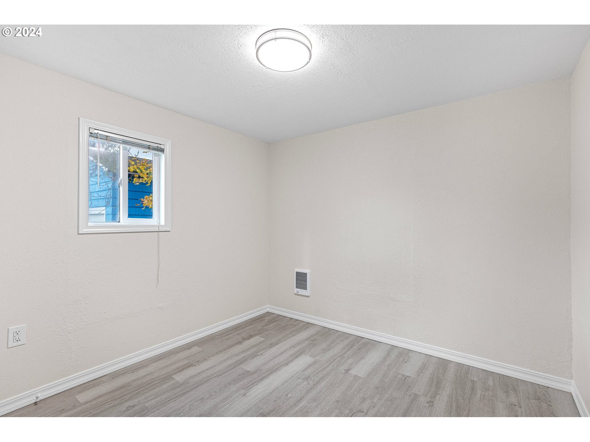 1356 D Street Springfield, OR 97477 - Photo 26 of 45 a view of an empty room with wooden floor