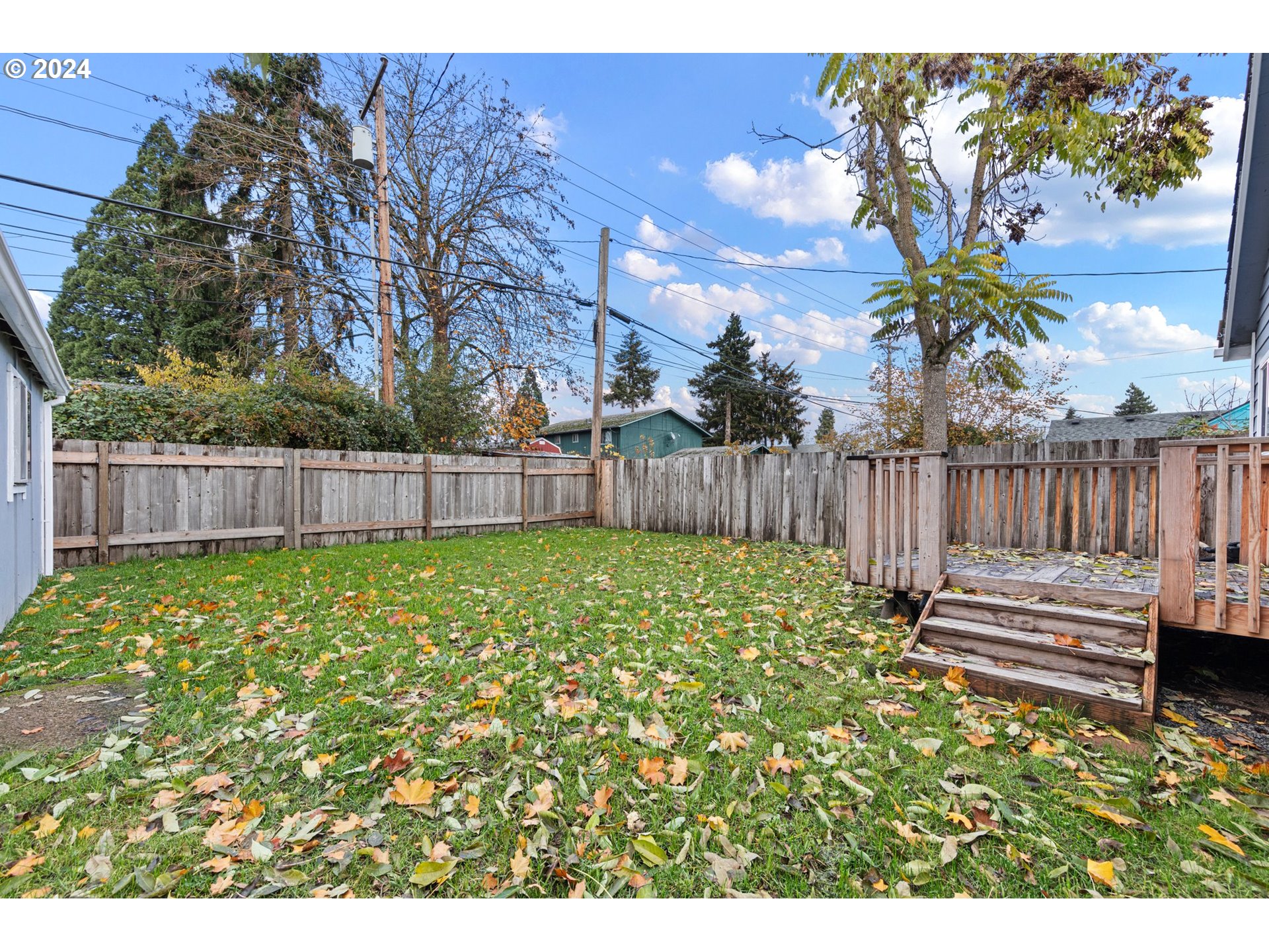 1356 D Street Springfield, OR 97477 - Photo 39 of 45 a view of a backyard with wooden fence