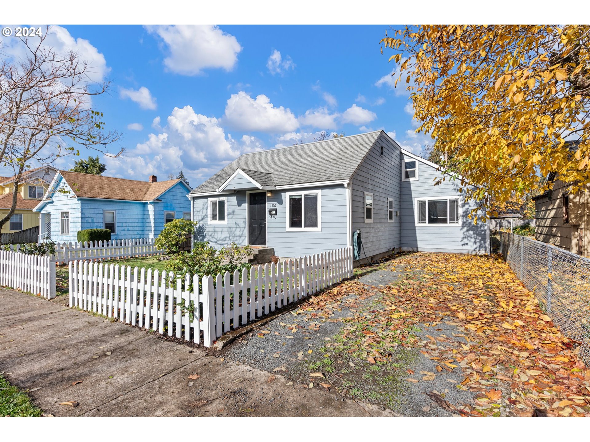 1356 D Street Springfield, OR 97477 - Photo 44 of 45 a view of a house with a wooden fence