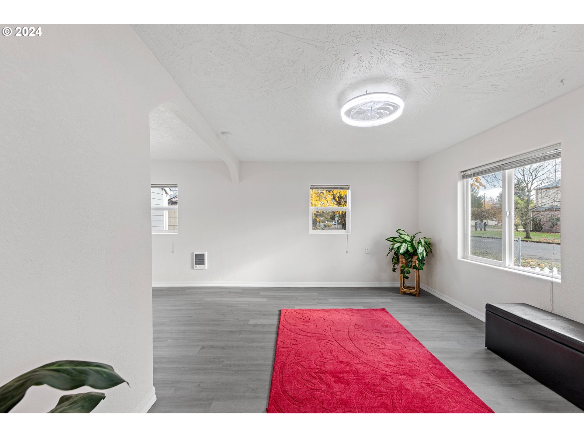 1356 D Street Springfield, OR 97477 - Photo 5 of 45 a picture of a room with a window and wooden floor