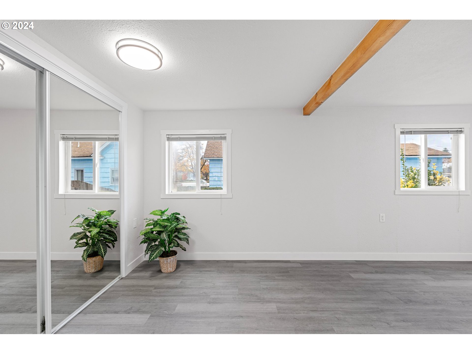 1356 D Street Springfield, OR 97477 - Photo 9 of 45 a view hallway with wooden floor and a potted plant