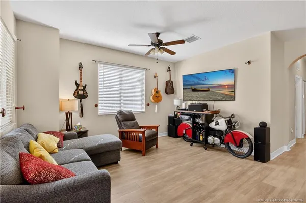 an aerial view of residential houses and lake