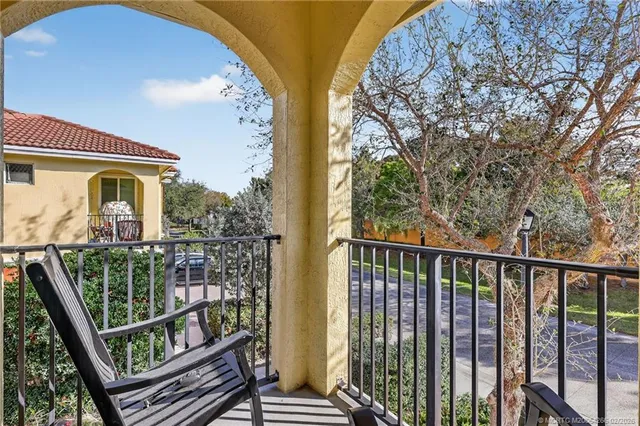 a kitchen with a sink and steel appliances