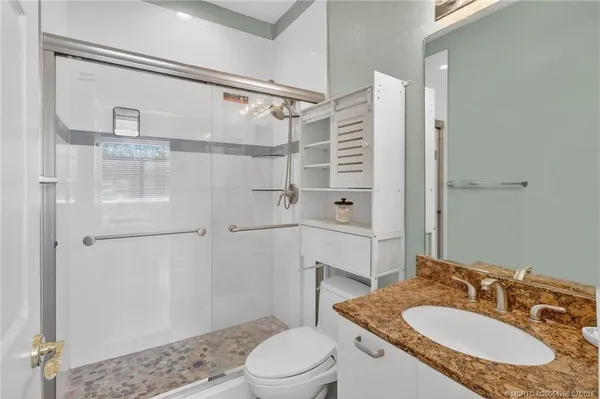 a living room with furniture a rug and a window