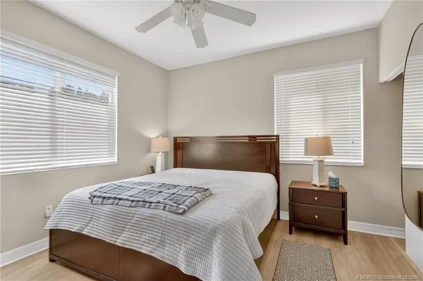 a view of balcony with wooden floor and fence