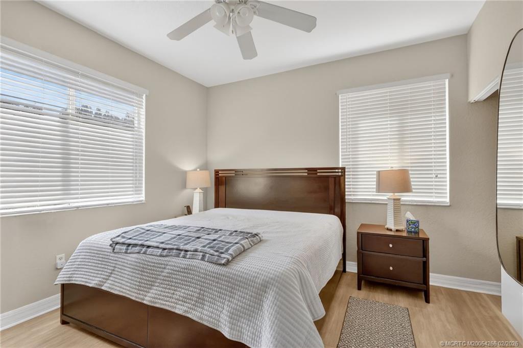 61 Southeast Palermo, Unit 204 Stuart, FL 34994 - Photo 15 of 32 Lovely primary bedroom with walk in closet and en suite bathroom.