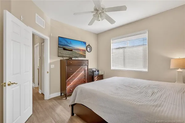 a bedroom with a bed and a table in it