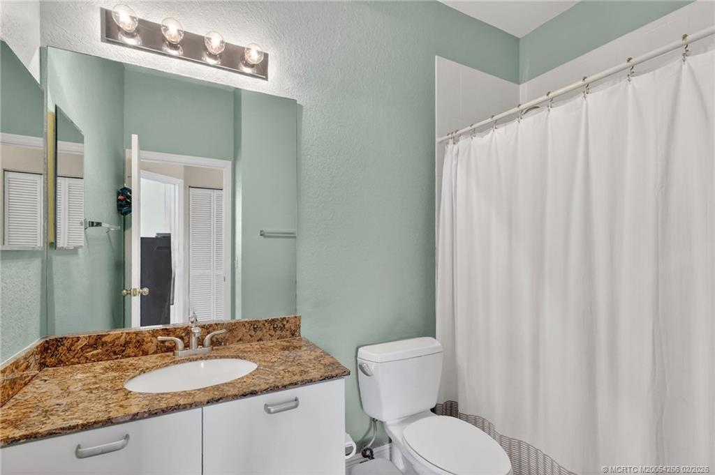 61 Southeast Palermo, Unit 204 Stuart, FL 34994 - Photo 17 of 32 En suite bathroom.