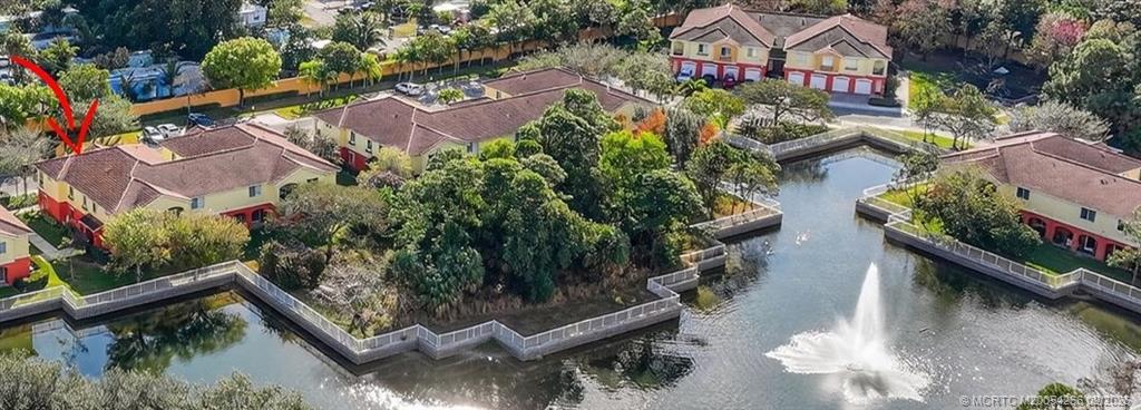 61 Southeast Palermo, Unit 204 Stuart, FL 34994 - Photo 28 of 32 Vilabella pond and fountain, beautiful grounds.