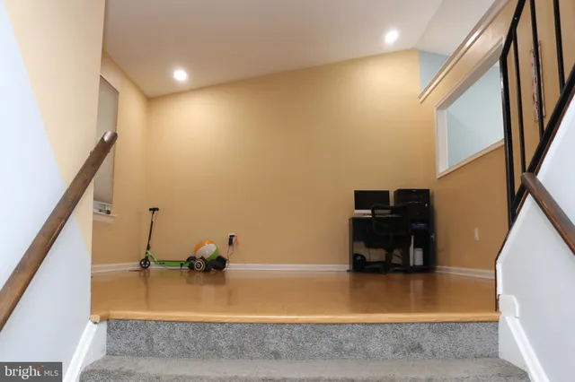 a view of kitchen and hall with wooden floor