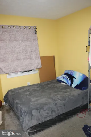 a view of a bedroom with a bed