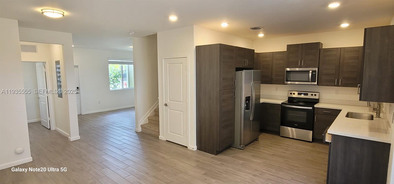 2459 Southeast 10th Street Homestead, FL 33035 - Photo 2 of 15 a kitchen with stainless steel appliances granite countertop a refrigerator and a stove top oven