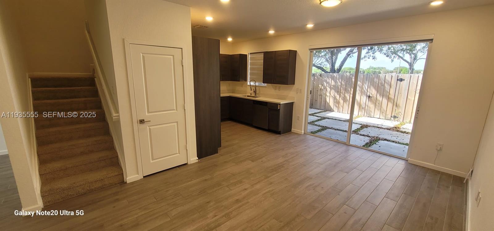 2459 Southeast 10th Street Homestead, FL 33035 - Photo 6 of 15 a view of a living room with hardwood floor and a large window