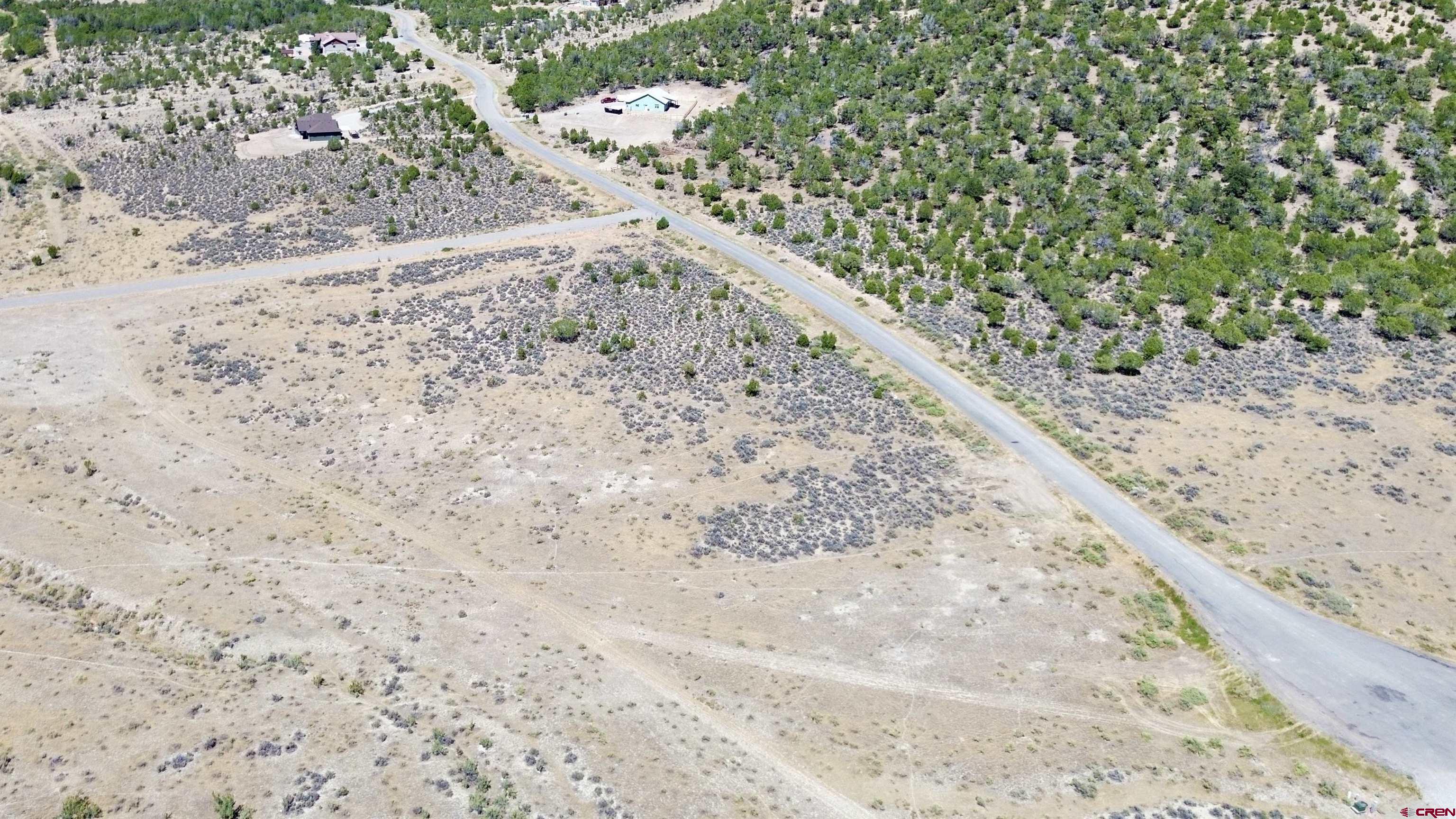 Tbd Lot 26 Tbd Road Montrose, CO 81401 - Photo 7 of 15 a view of a dry yard with wooden fence