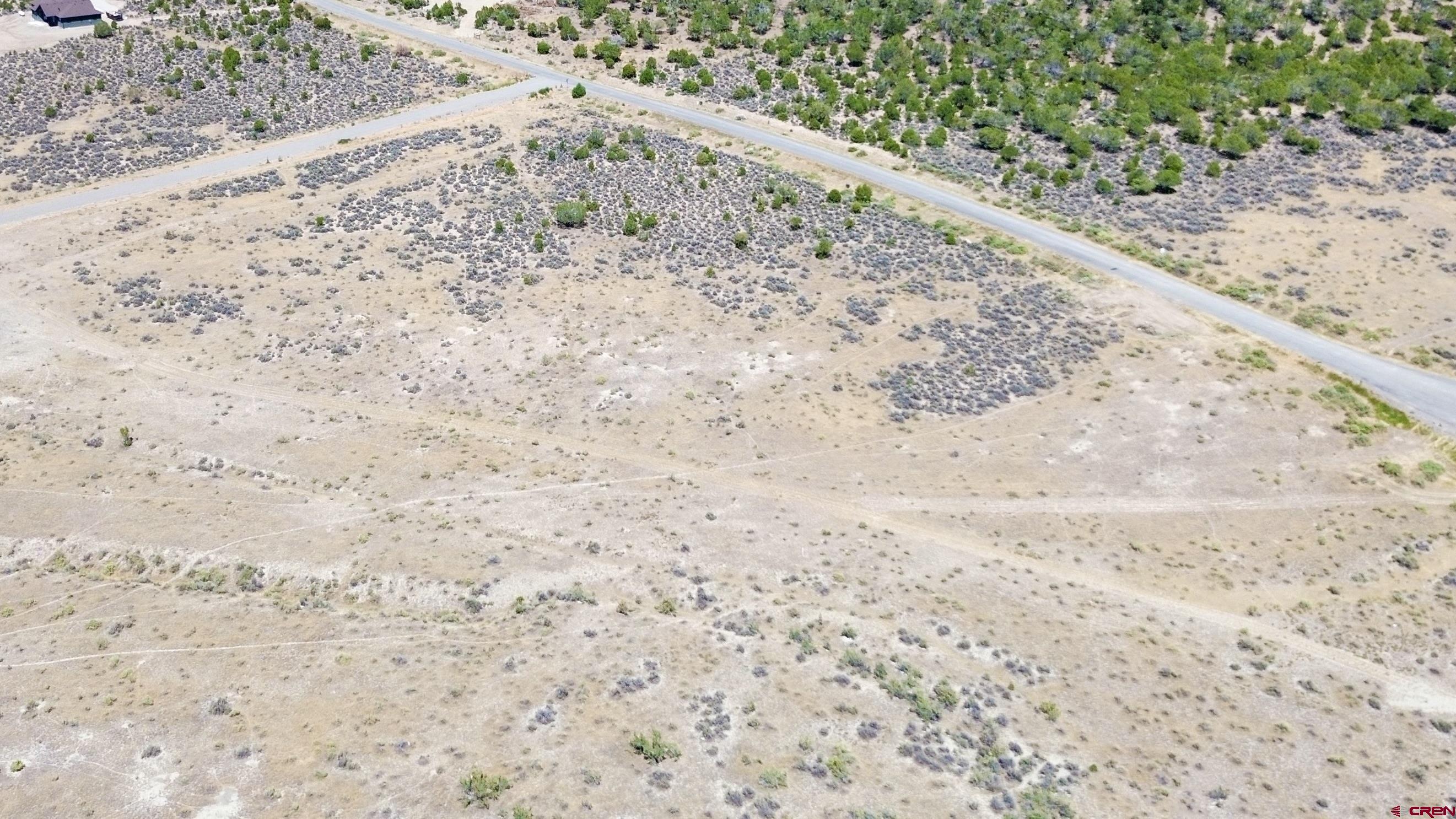 Tbd Lot 26 Tbd Road Montrose, CO 81401 - Photo 8 of 15 a view of a beach with a yard