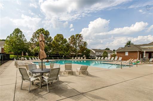 1101 Downs Boulevard, Unit A103 Franklin, TN 37064 - Photo 17 of 18 a view of a swimming pool with a patio and a yard
